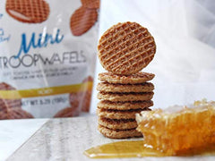 Close-up of soft toasted waffles with honey filling, ideal for cozy mornings.
