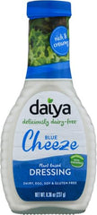 Daiya Blue Cheeze Dressing pour illustrating versatile, plant-based drizzle.