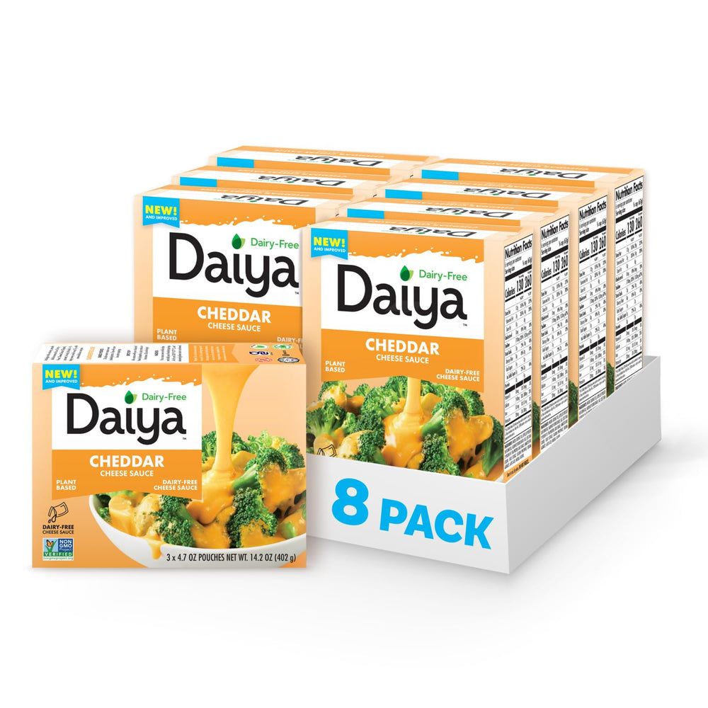 Daiya Dairy Free Cheddar Sauce pouch pouring for creamy topping