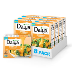 Daiya Dairy Free Cheddar Sauce pouch pouring for creamy topping