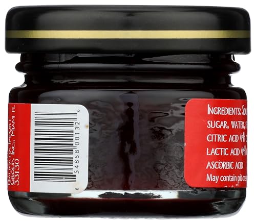 Dalmatia Spread Sr Chry Mini Jar spoon-scoop closeup emphasizes smooth, rich texture.