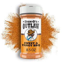 Dano's Outlaw Sweet & Tangy BBQ jar on the counter boosts pork flavor on the grill