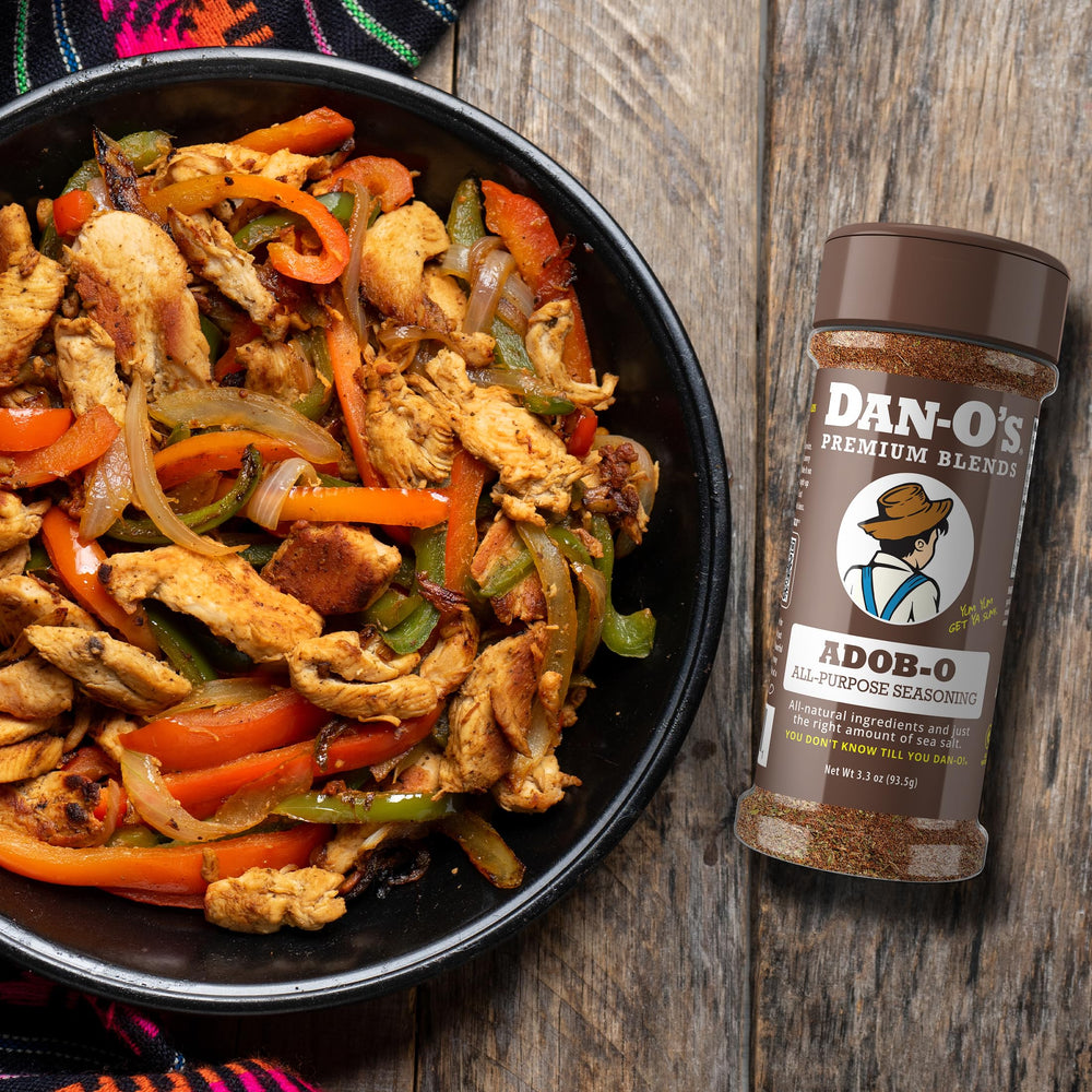 Dan-O's Adob-O seasoning in tacos night setup for zesty finish.