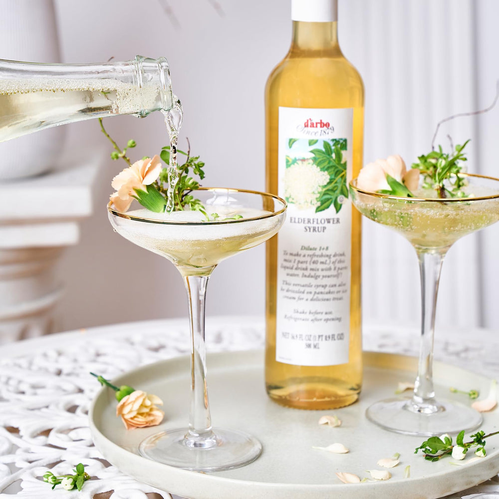 Darbo Elderflower Syrup being poured into a glass ideal for cocktails