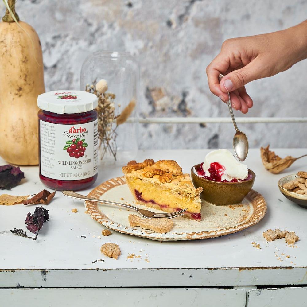 D'Arbo lingonberry sauce spoonful evokes tart, delicate sweetness ideal for desserts.