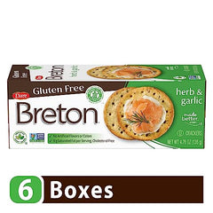 Dare Breton Herb Garlic crackers on plate with dip, versatile snack idea.