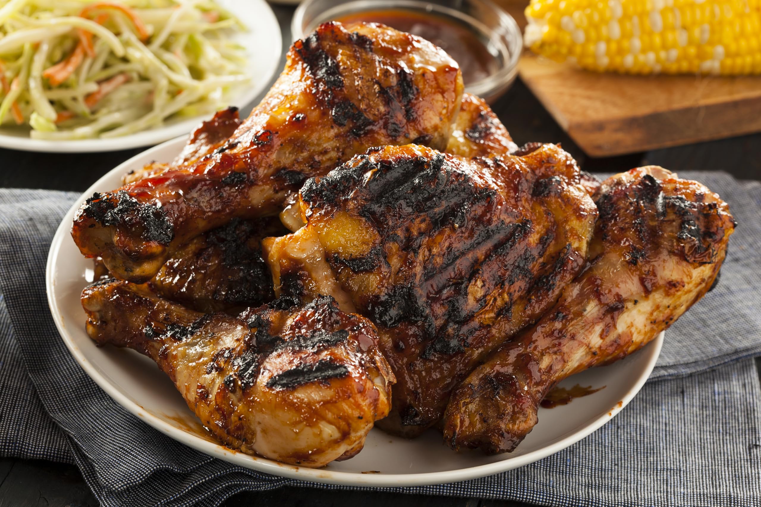 Cooked chicken plated with Dash Salt-Free Grilling Blend touch.