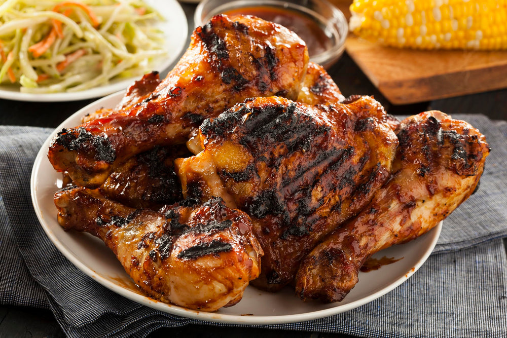 Cooked chicken plated with Dash Salt-Free Grilling Blend touch.