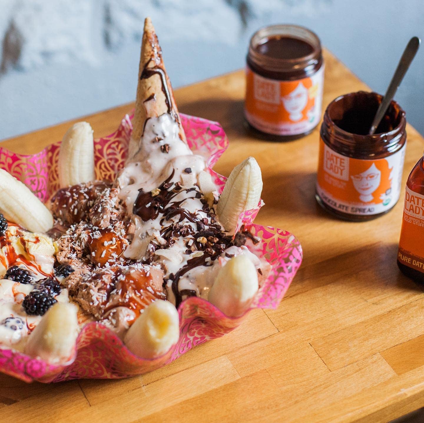 Date Lady chocolate date spread ice-cream-sauce drizzled over dessert
