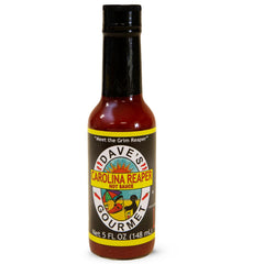 Dave's Gourmet Carolina Reaper Hot Sauce bottle adds fiery heat to tacos.