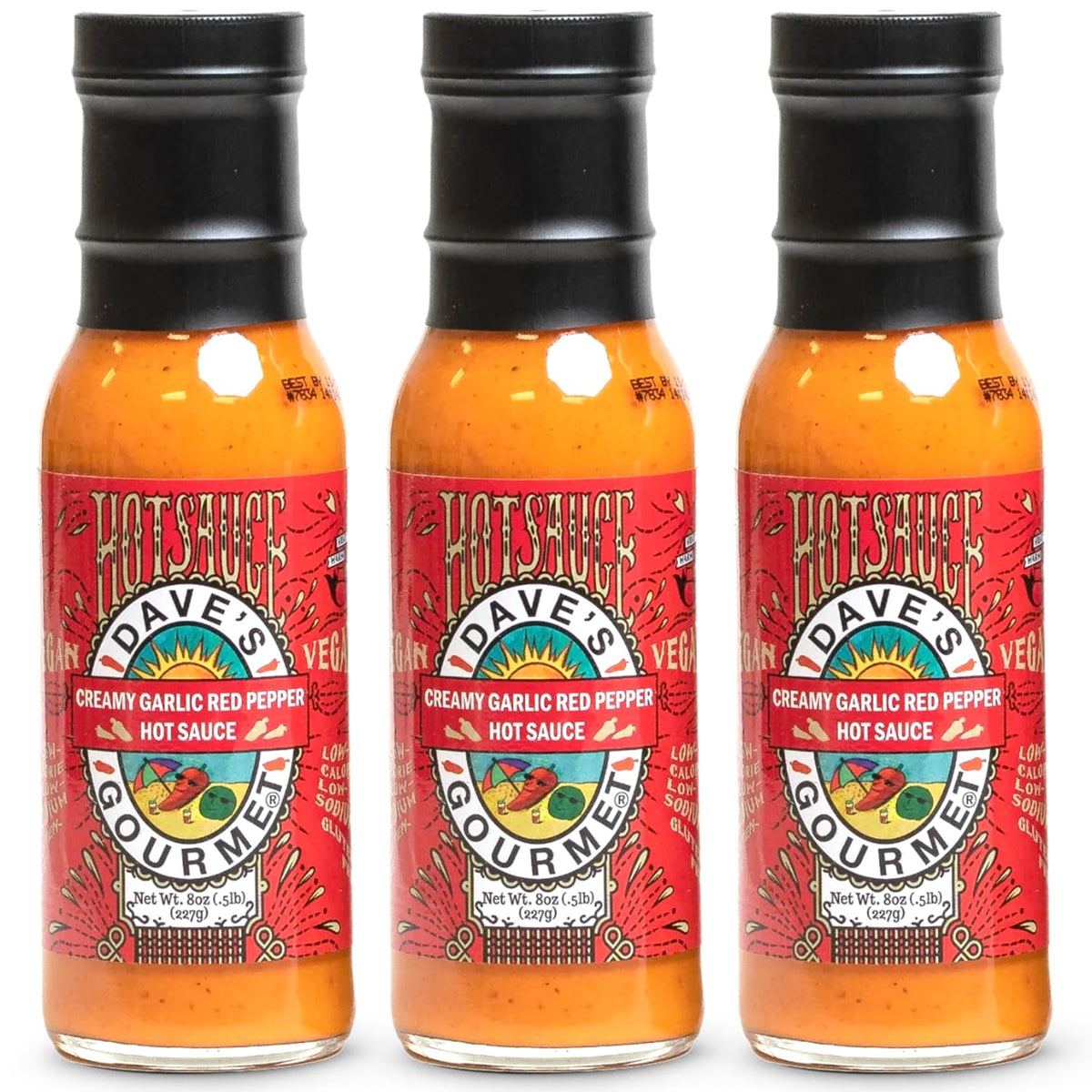 Dave's Gourmet Creamy Garlic Red Pepper Sauce bottle front displaying creamy heat and flavor