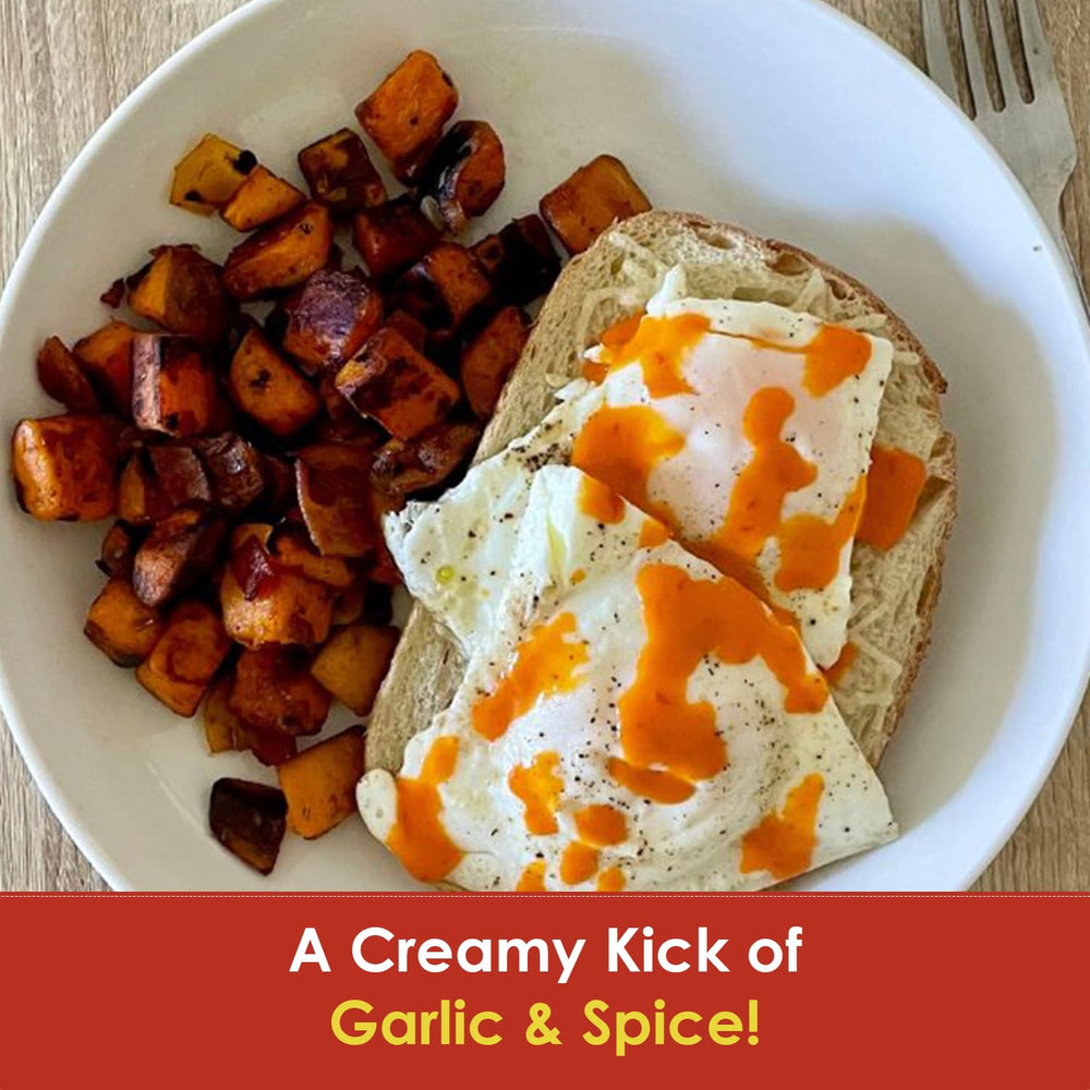 Creamy garlic red pepper sauce spread on a sandwich for extra richness.