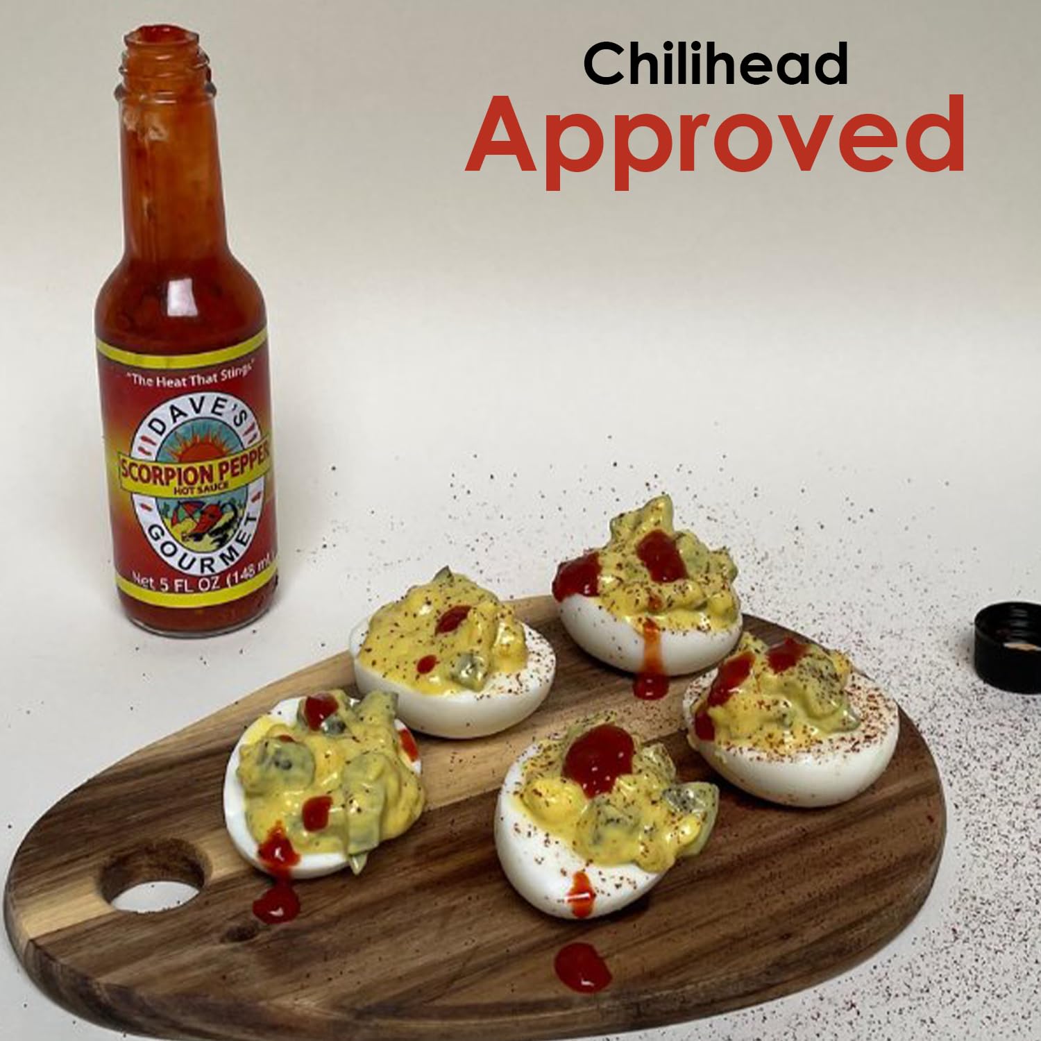 Dave's Gourmet hot sauce drizzle over pizza showing vibrant color