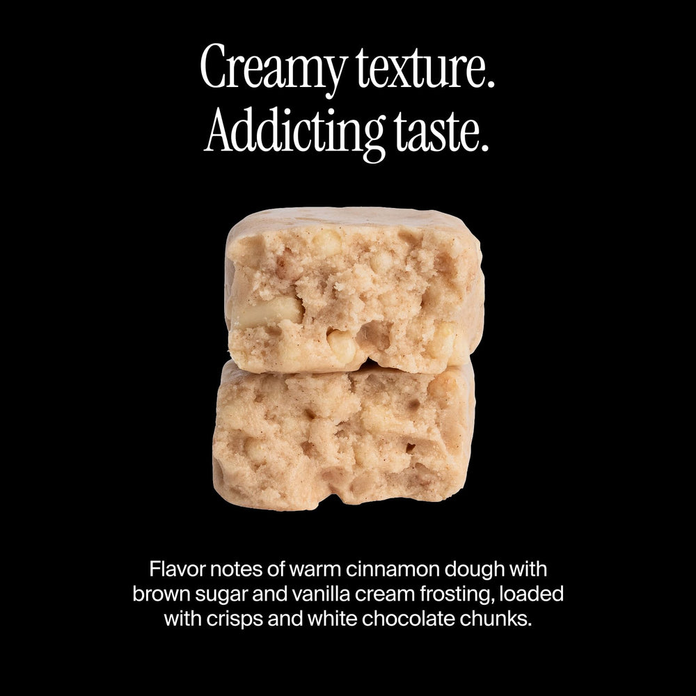 David Protein Bar Cinnamon Roll bite reveals chewy texture and rich flavor.