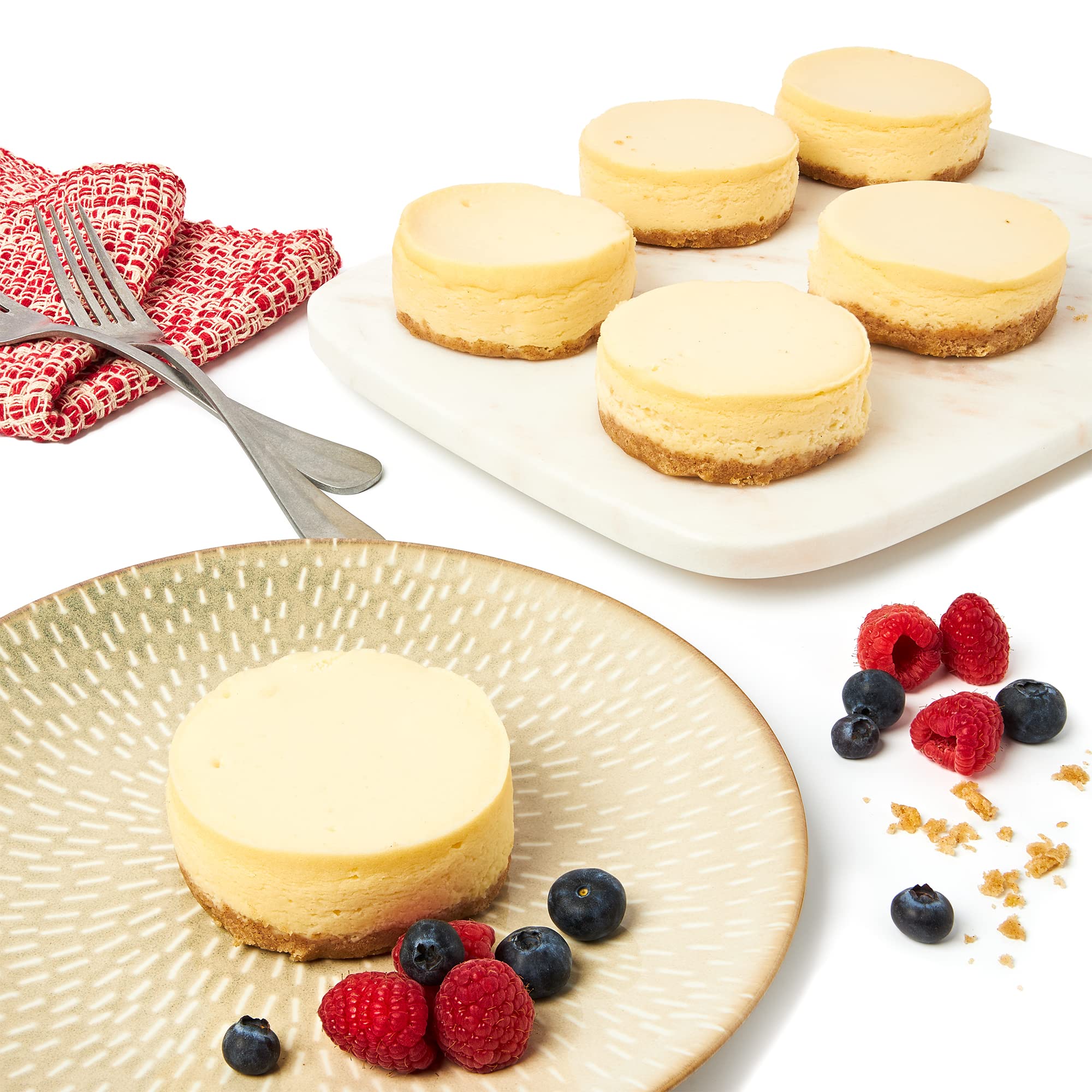 David's Cookies New York Mini Cheesecakes 6-pack on plate, ideal for entertaining guests.