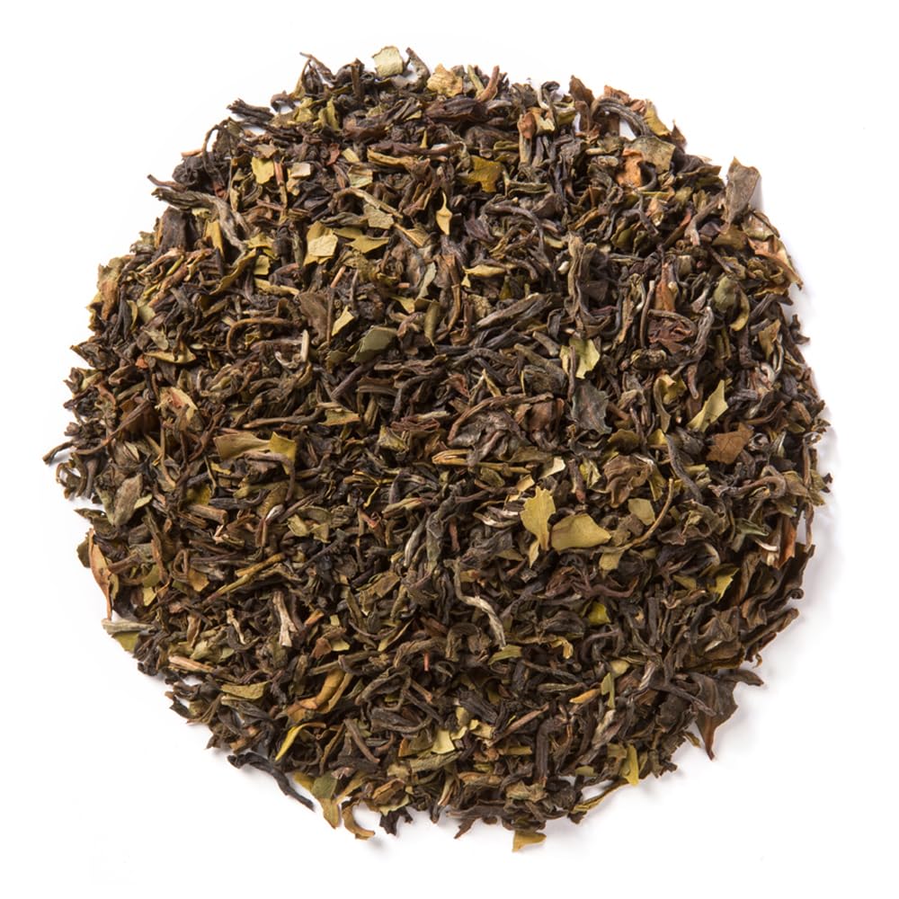 Davidson's Organics Himalayan White tea poured into a cup, floral aroma and light sweetness.