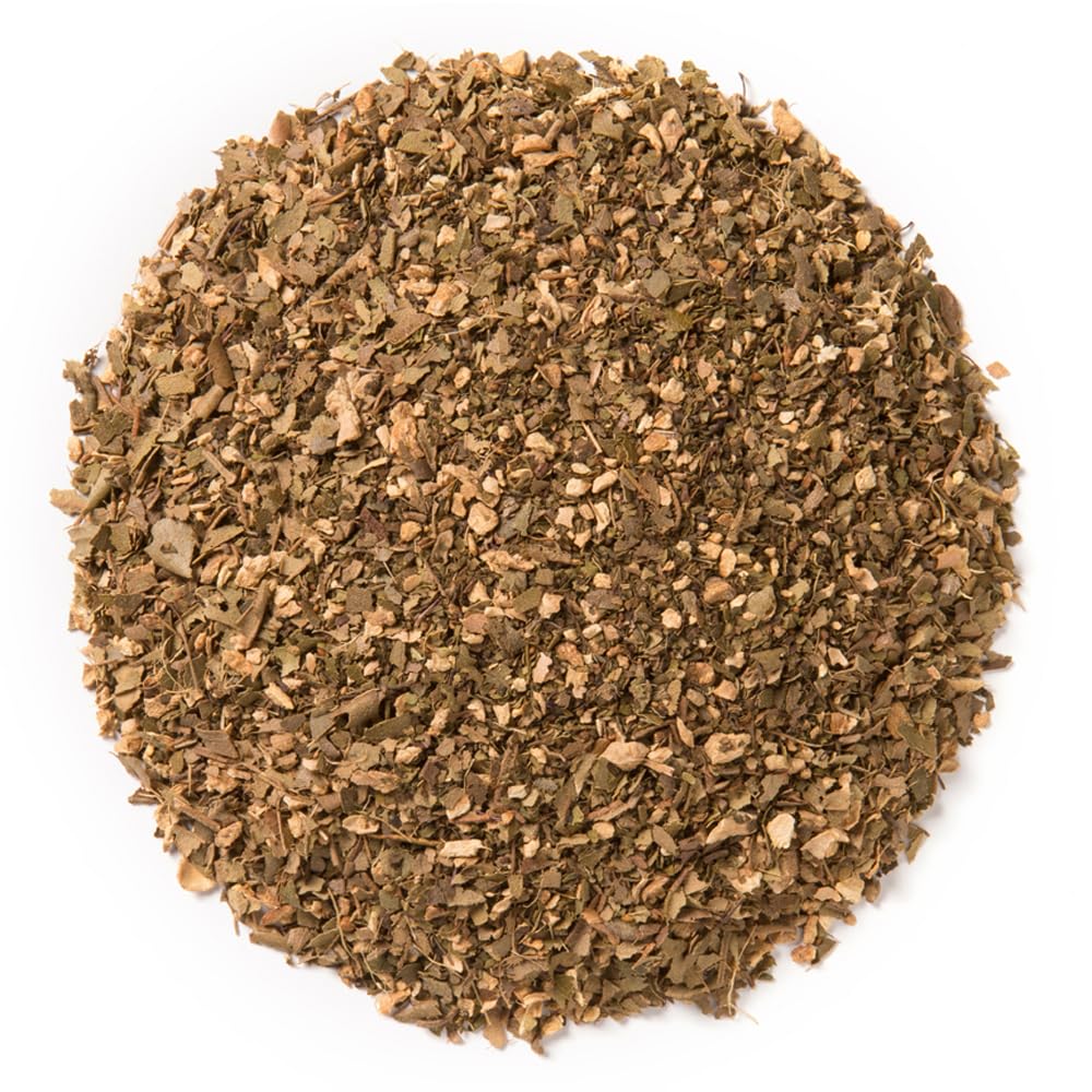 Davidson's Tulsi Ginger Lemon tea cup pouring, showcasing vibrant infusion and inviting aroma.