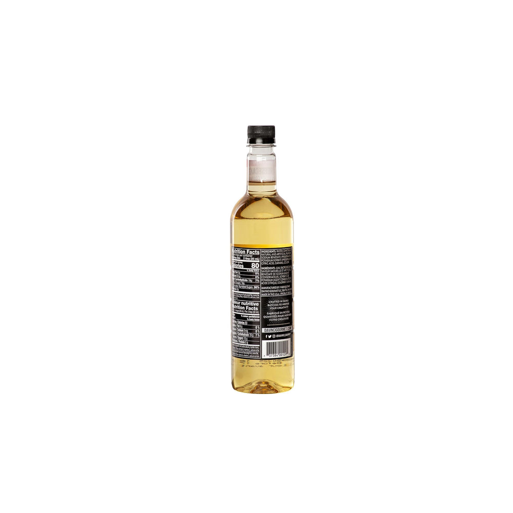 Pouring DaVinci Gourmet Classic Cheesecake Syrup over a beverage for sweetness.