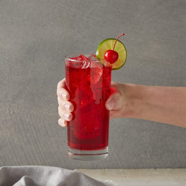 Cherry syrup bottle emphasizes cane sugar for natural sweetness and balance.