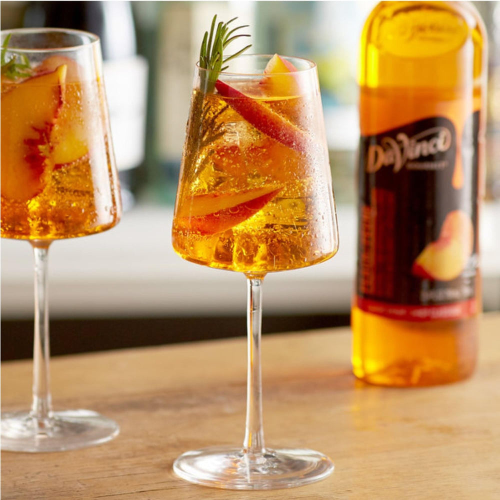 Cold beverage featuring DaVinci Gourmet Classic Peach syrup shows versatility.