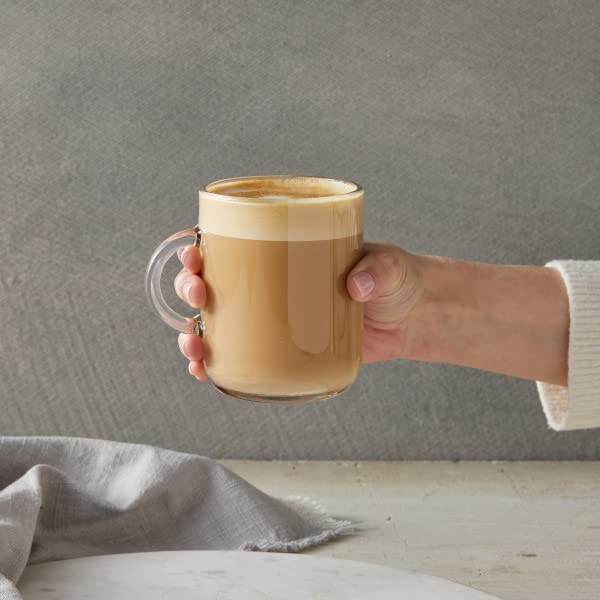 Milk froth with white chocolate syrup swirl adding a creamy layer