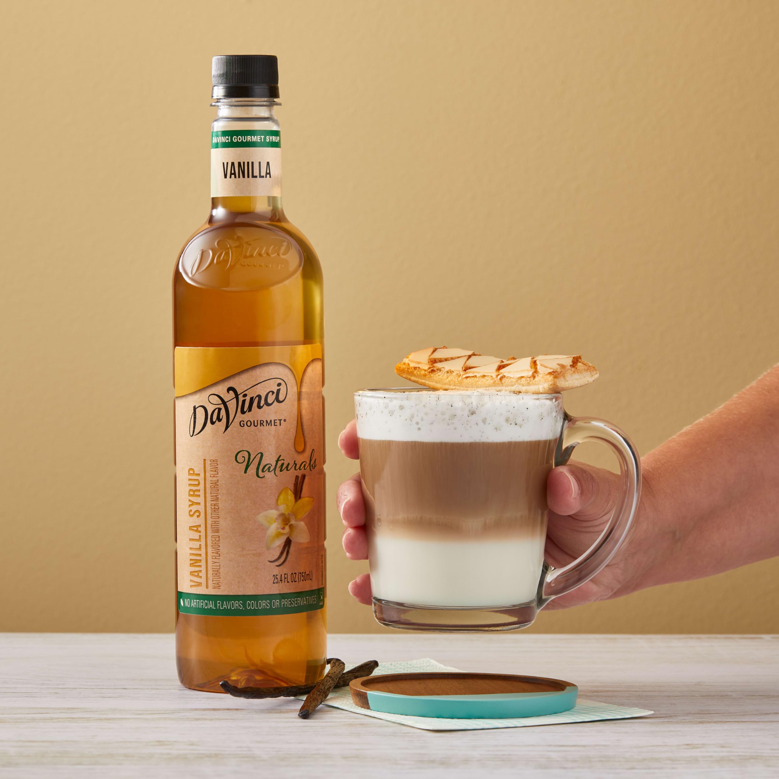 DaVinci Gourmet Naturals Vanilla Syrup 750 ml package on countertop for kitchen creativity.