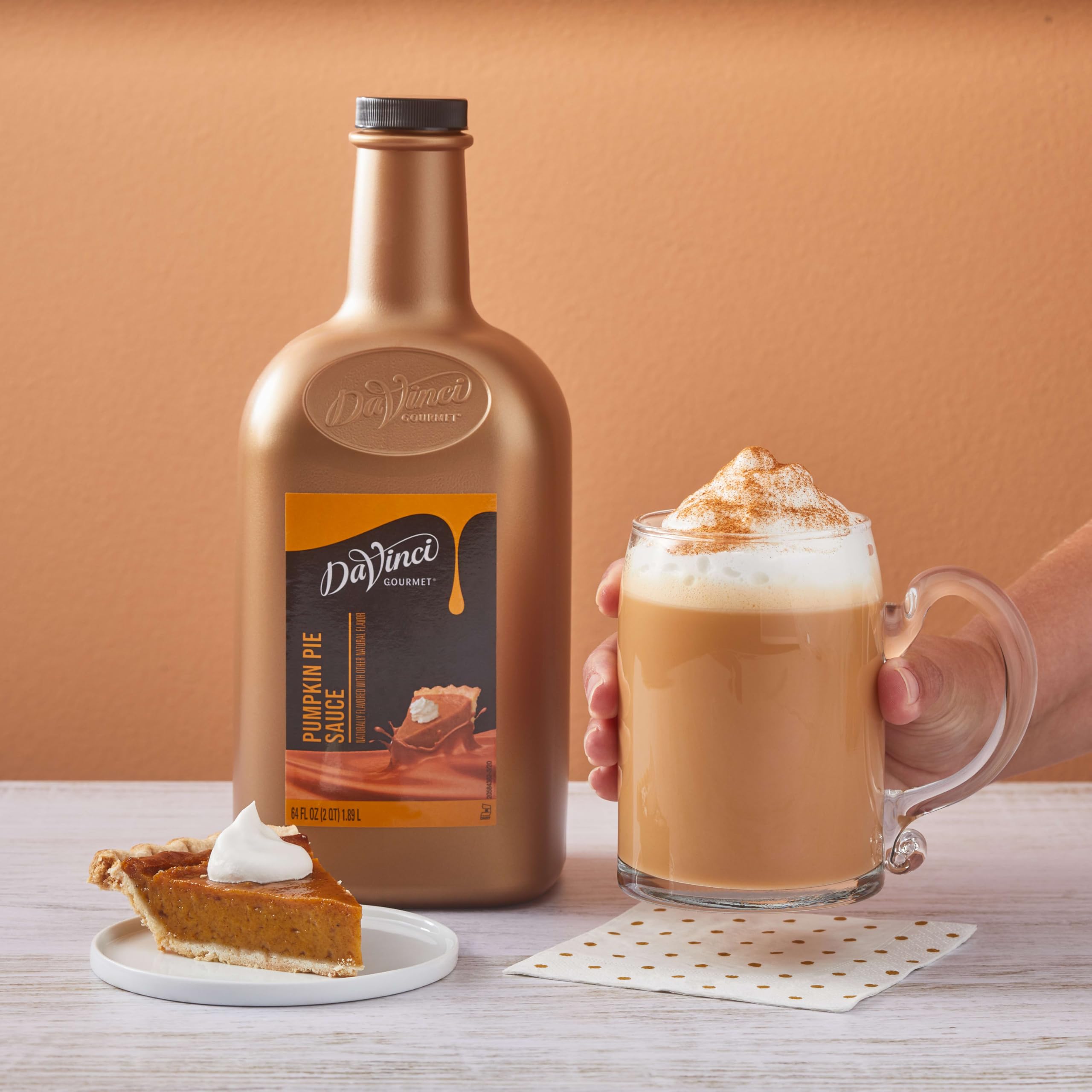 DaVinci Gourmet Pumpkin Pie Sauce bottle beside spices inspires kitchen creativity.