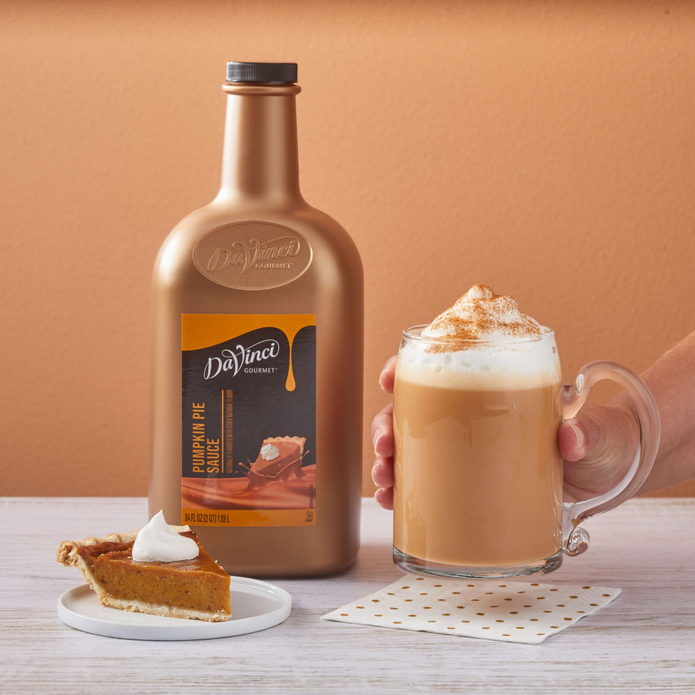 DaVinci Gourmet Pumpkin Pie Sauce bottle beside spices inspires kitchen creativity.