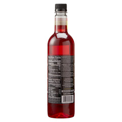 Pouring DaVinci Gourmet Sour Gummy Syrup for tangy-sweet drinks.