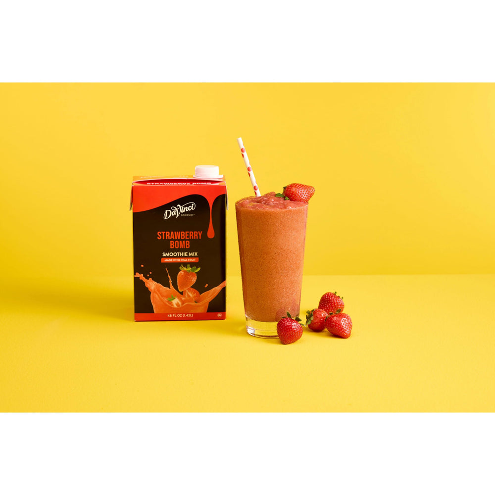 DaVinci Gourmet Strawberry Bomb being blended into a creamy smoothie.