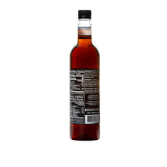 DaVinci Gourmet Sugar-Free Amaretto Syrup being poured into a cup
