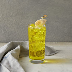 DaVinci Gourmet Sugar-Free Banana Syrup enhances coffee; dairy-friendly mixing shown