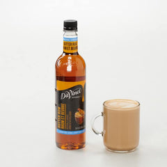 DaVinci Gourmet Sugar-Free Butter Rum Syrup in a coffee, enhancing flavor without sugar.