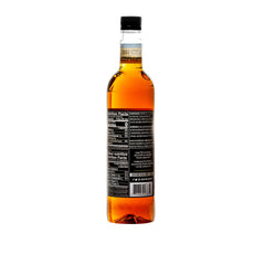DaVinci Gourmet sugar-free syrup being poured into a cup for beverages