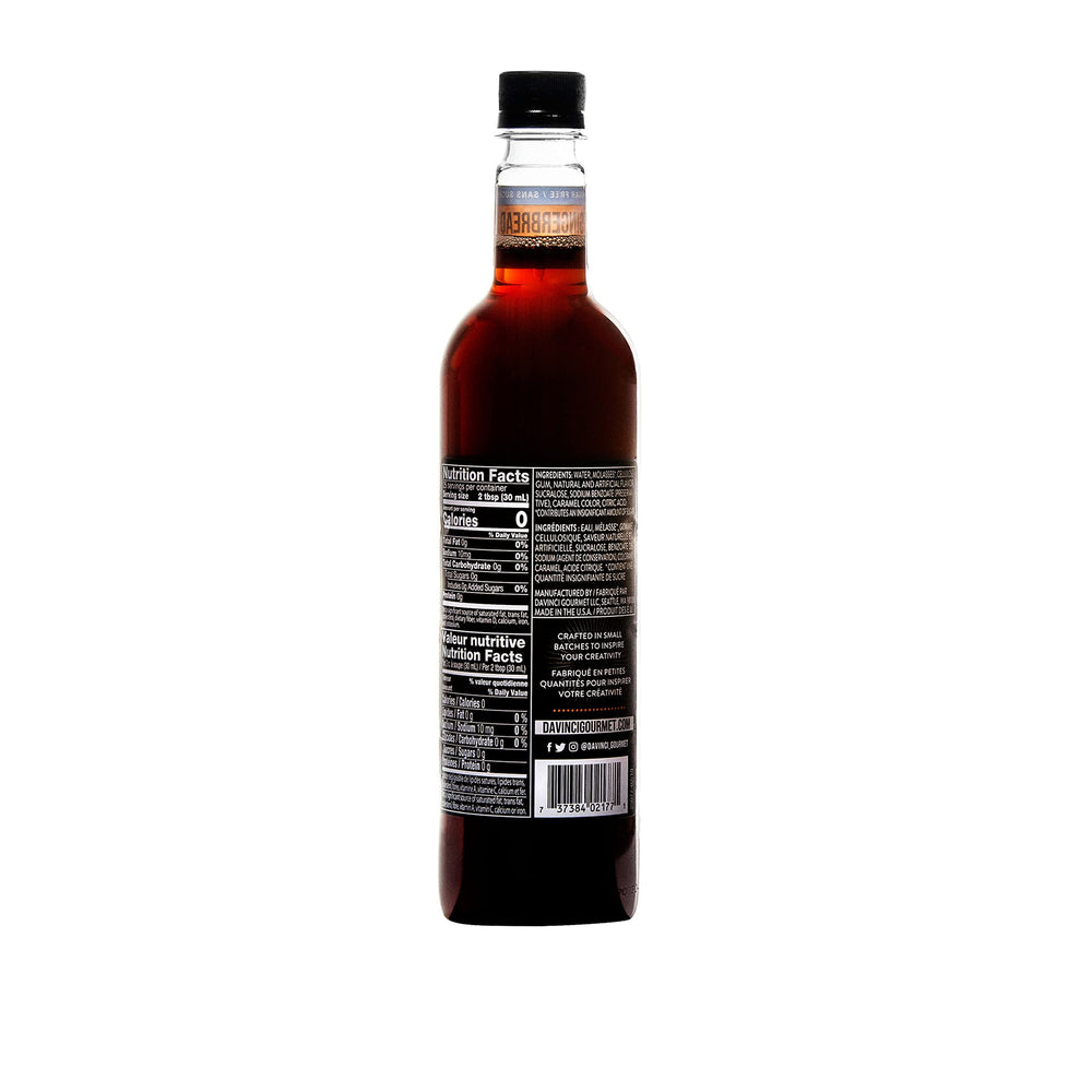 Pouring DaVinci Gourmet Sugar-Free Gingerbread Syrup into hot cocoa for smooth spice.