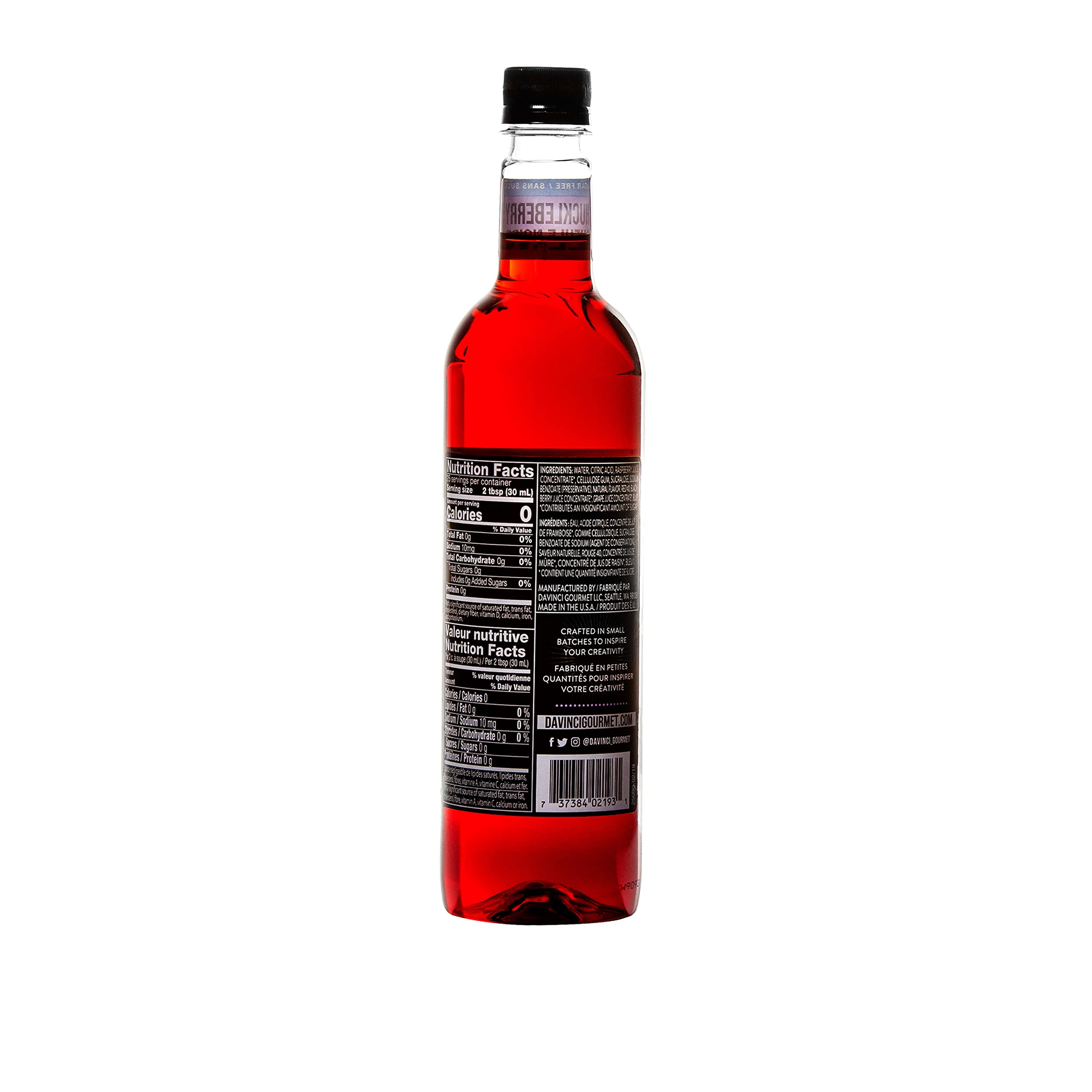 Pouring DaVinci Gourmet Sugar-Free Huckleberry Syrup into a coffee cup.