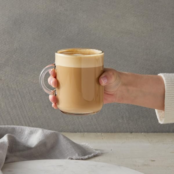 Milk glass swirled with DaVinci Gourmet vanilla syrup for dairy-friendly mix.