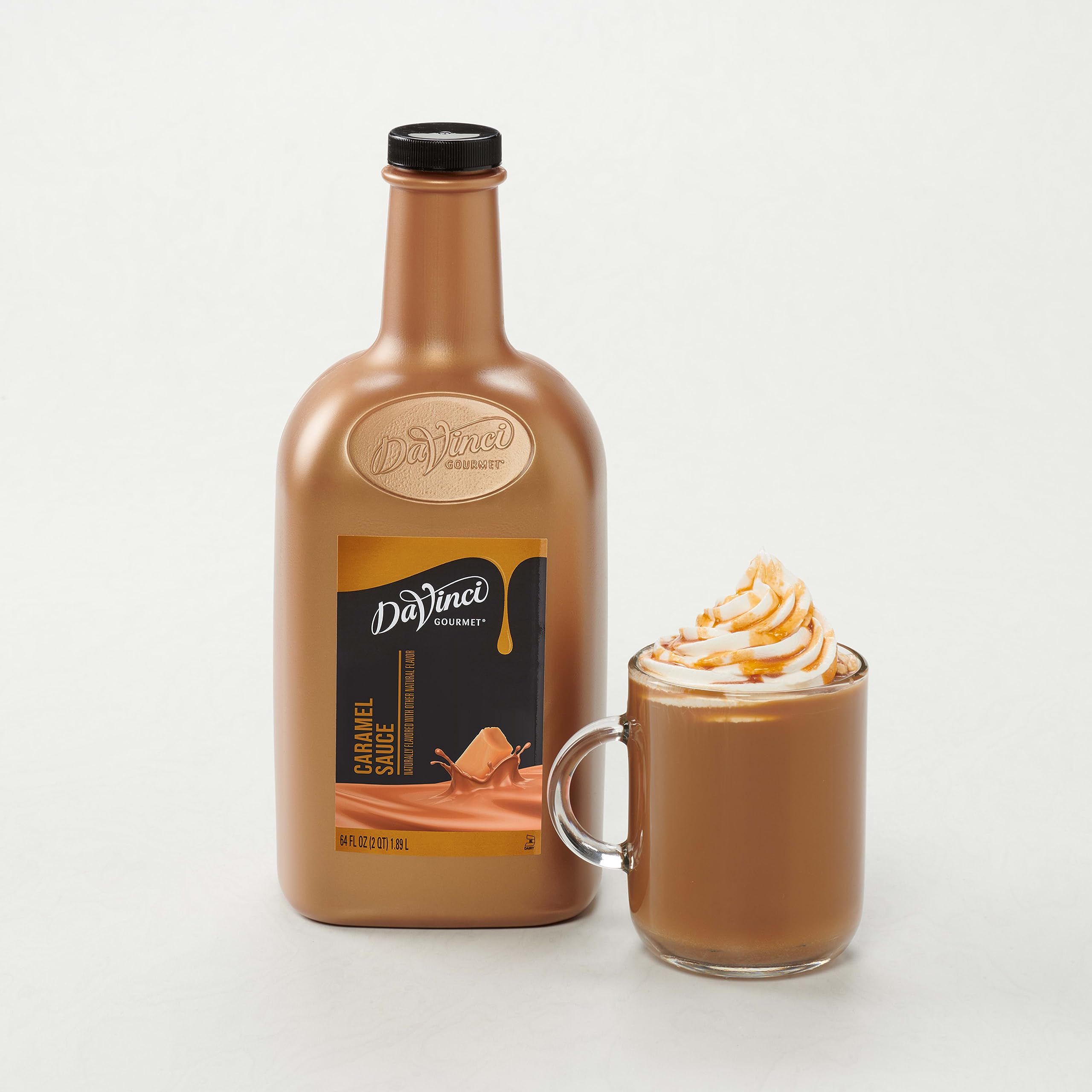 Tilted bottle shows the 64 oz size of DaVinci Gourmet Sugar Free Caramel Sauce.