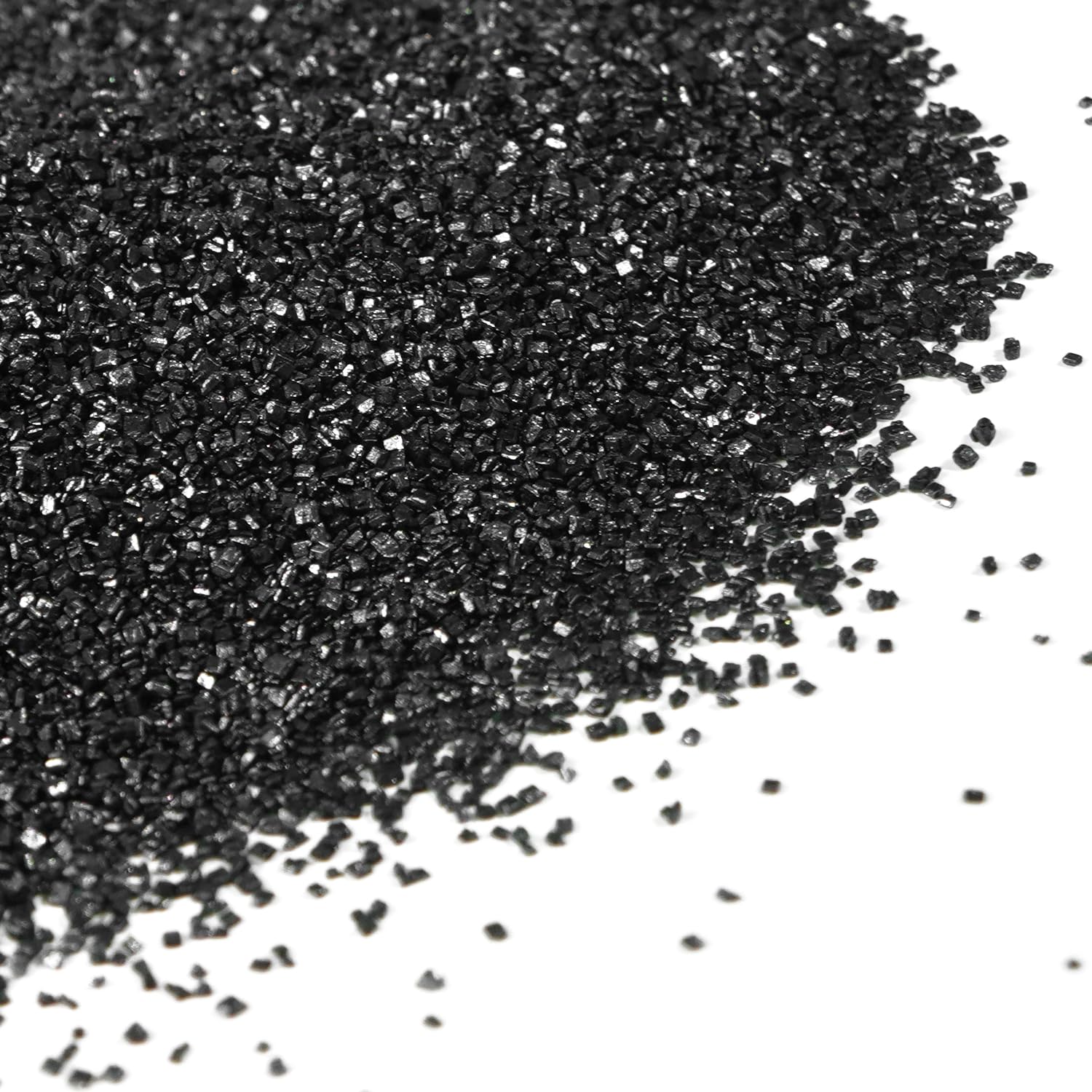Dazzjoy black sanding sugar on a cake surface for dramatic decoration.