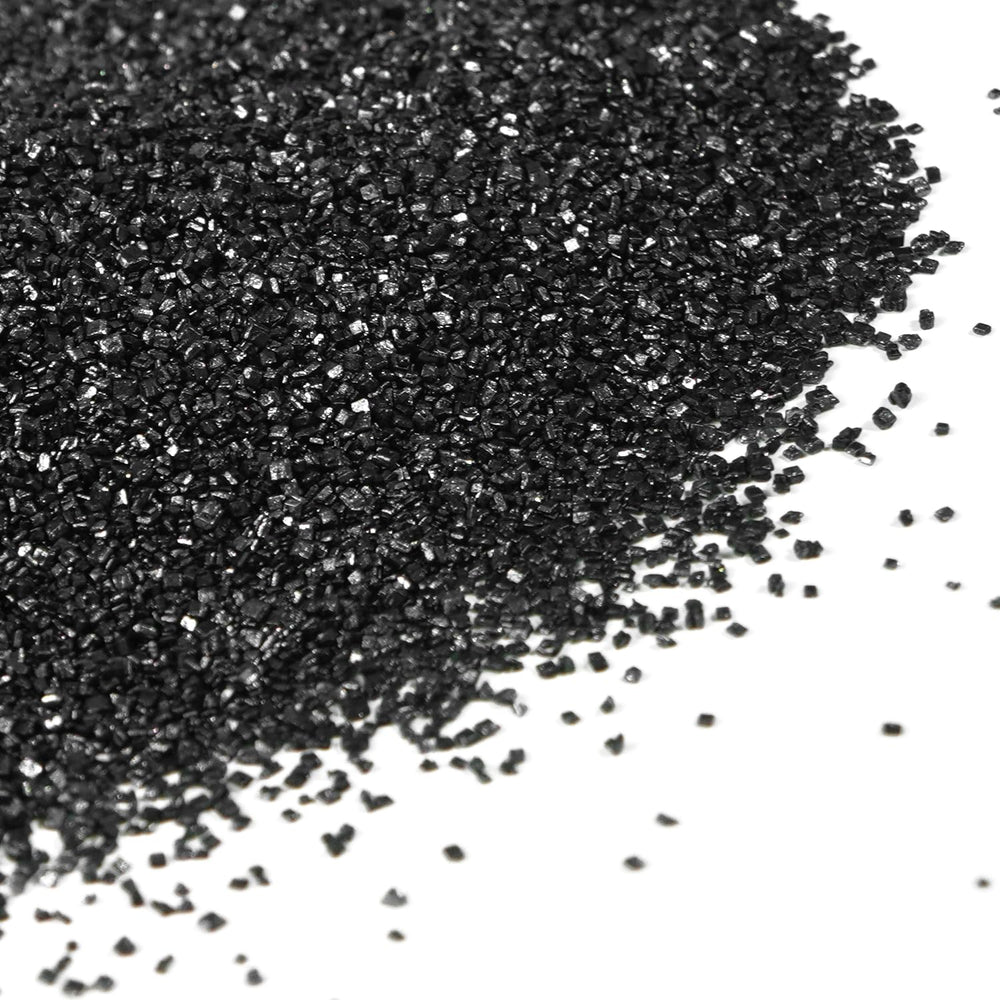 Dazzjoy black sanding sugar on a cake surface for dramatic decoration.