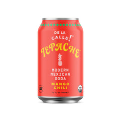 De La Calle Organic Mango Chili Tepache bottle on a bright table, refreshing and tangy.