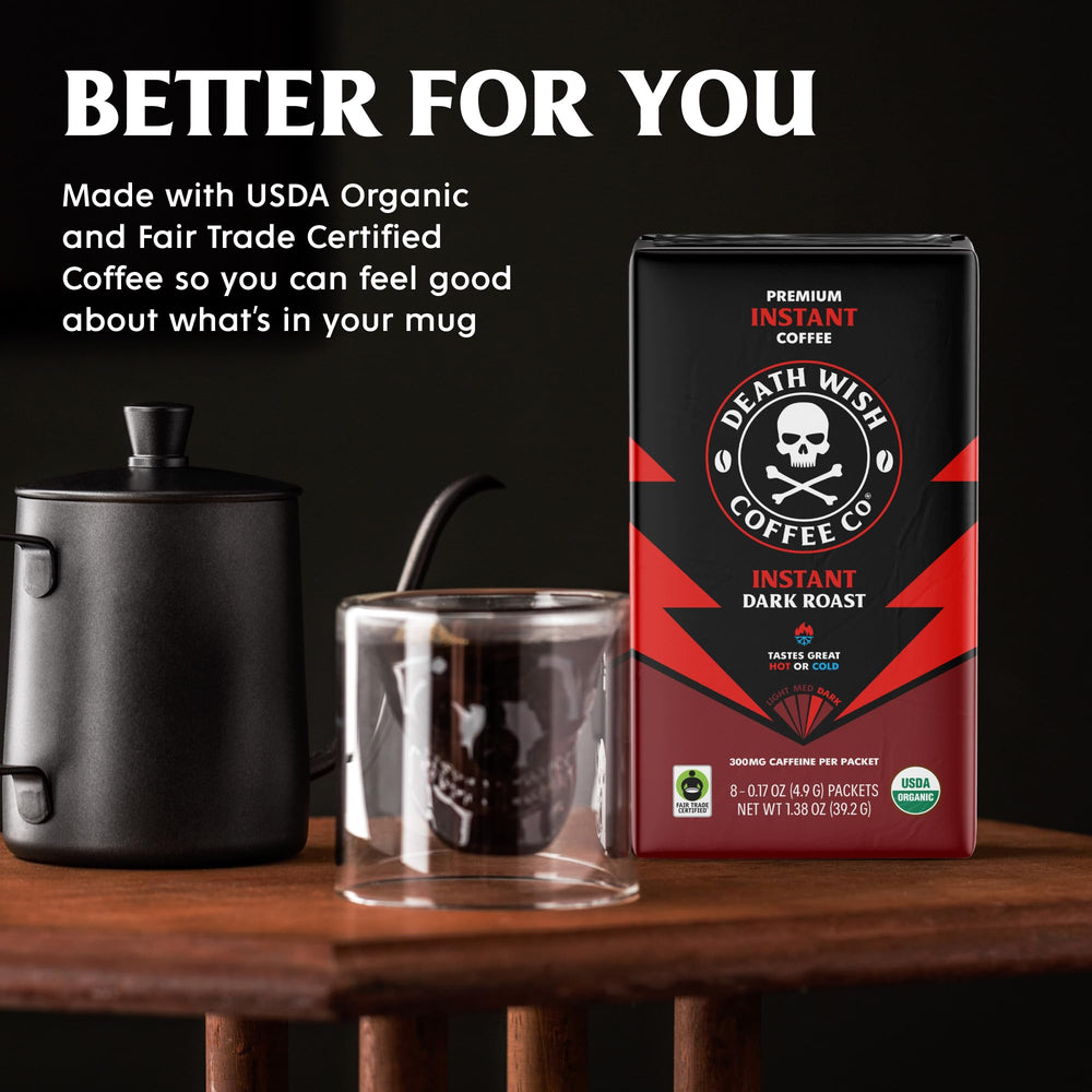 Death Wish Coffee cup with rich dark brew on desk