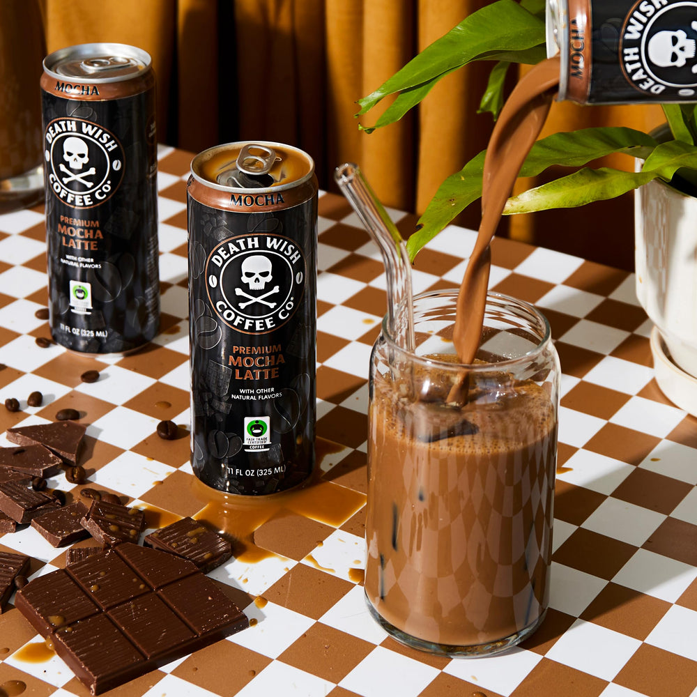 Death Wish Coffee milk chocolate notes in creamy latte close-up.