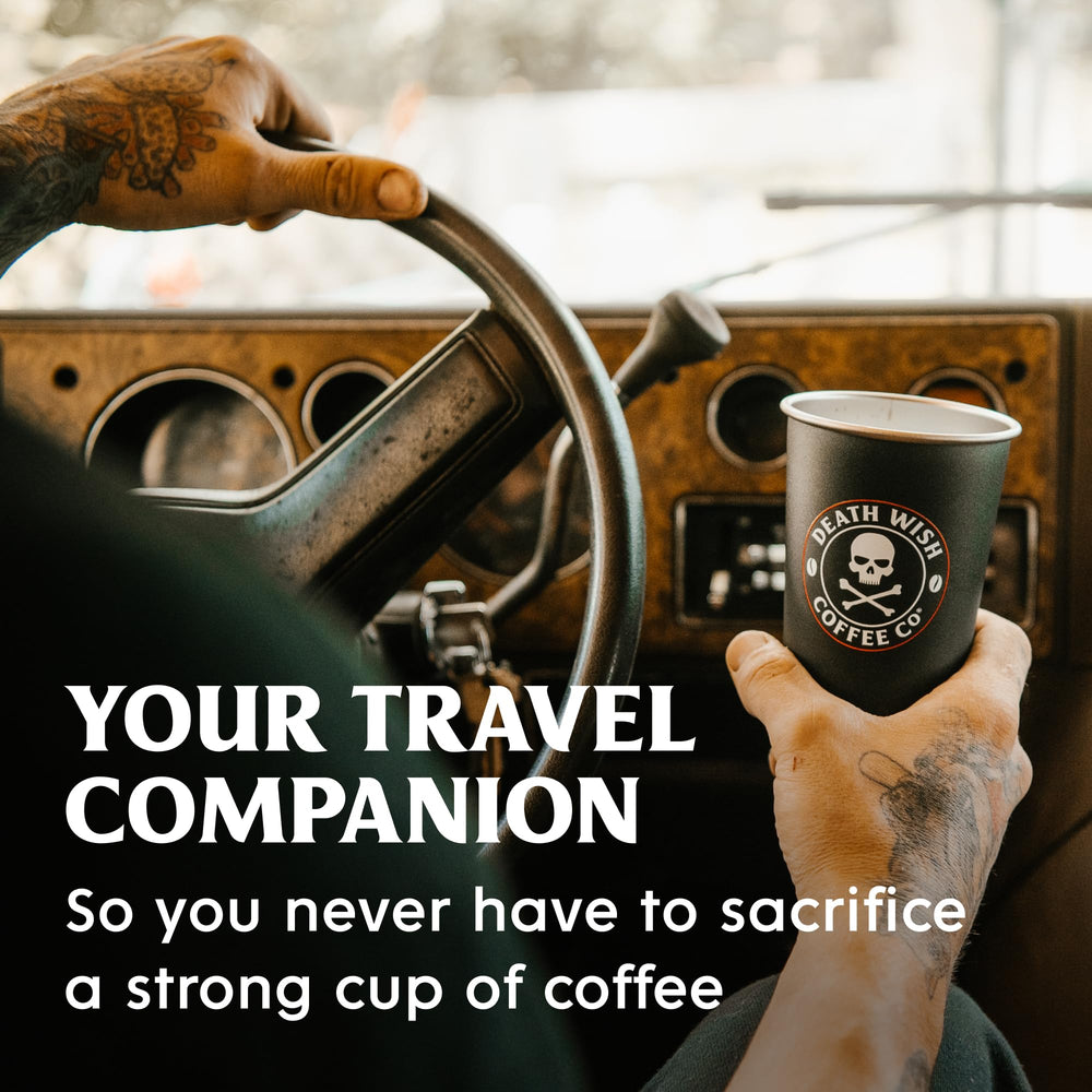 Death Wish Coffee single-serve packets beside mug ready to brew