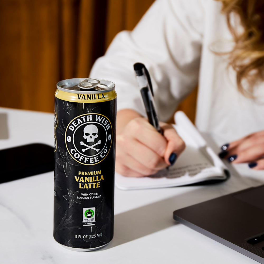 Death Wish Vanilla Latte glass with whisked foam, creamy texture at a glance.