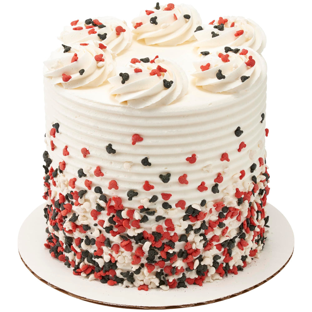 Mickey quins on cupcakes and cookies add bold color.
