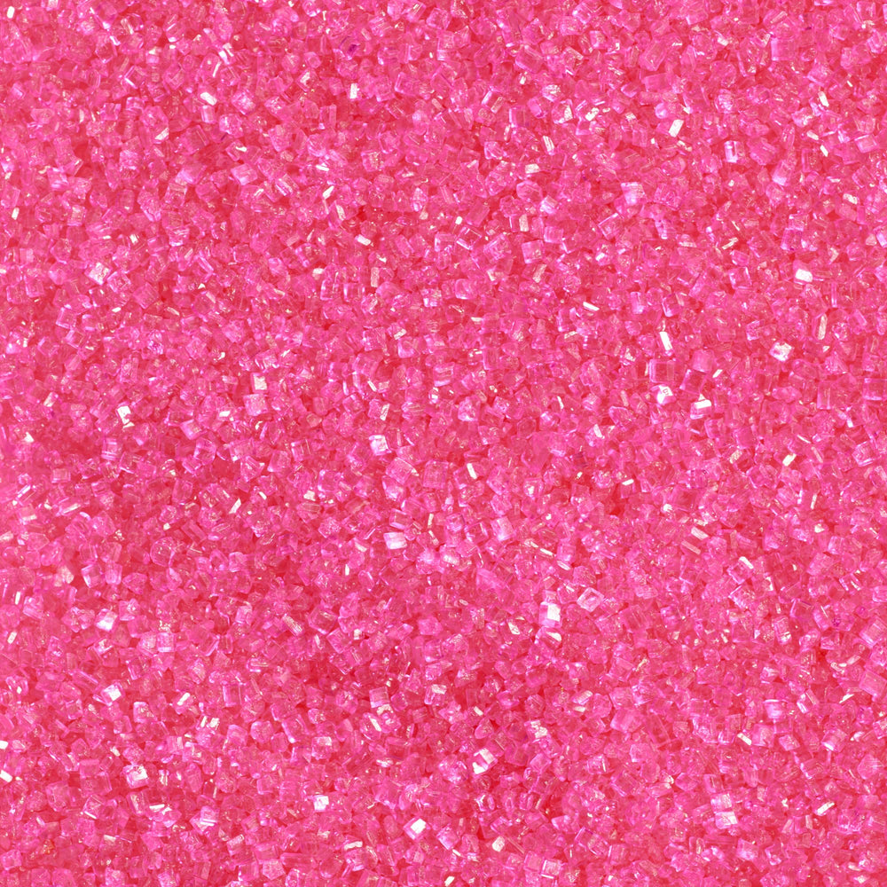 DecoPac Pink Sanding Sugar in a handheld jar adds sparkle to cakes