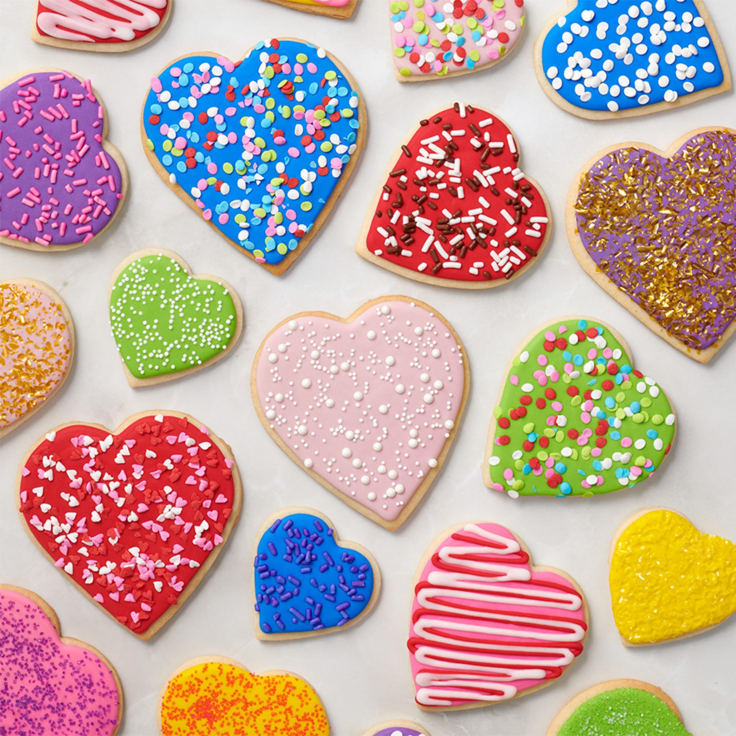 DecoPac Valentines Quins stored in handy handheld container for easy use.