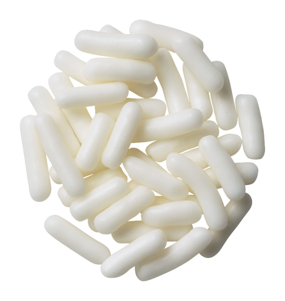 DecoPac white sprinkles topping a frosted cake for festive decoration.
