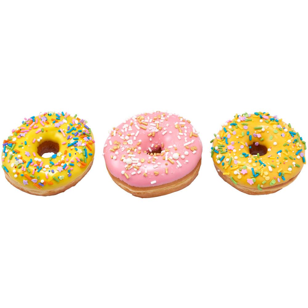Bright yellow, blue, green, and lilac sprinkles enhance pastel treats.